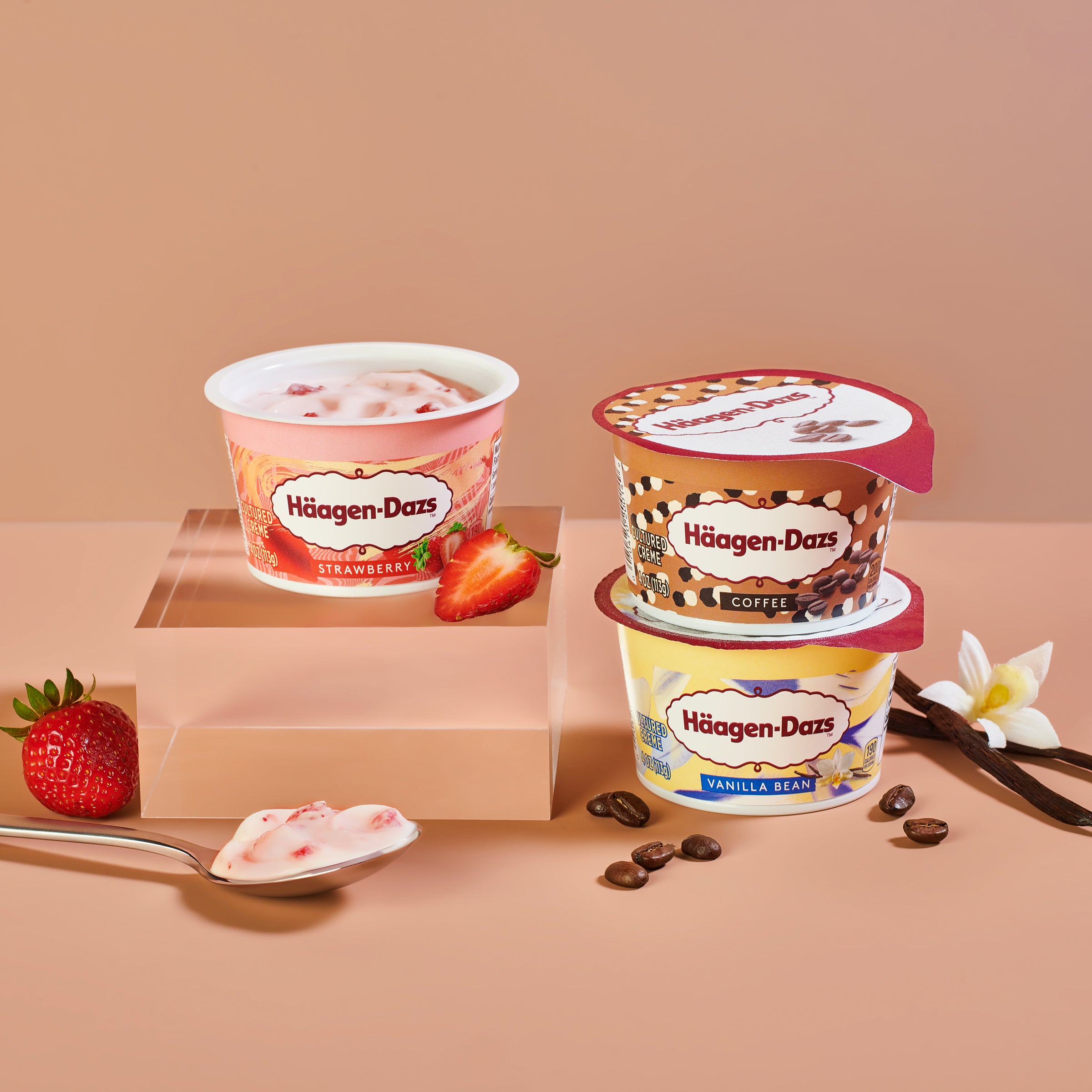 Häagen-Dazs Cultured Crème Strawberry on pedastal with Coffee and Vanilla Bean stacked